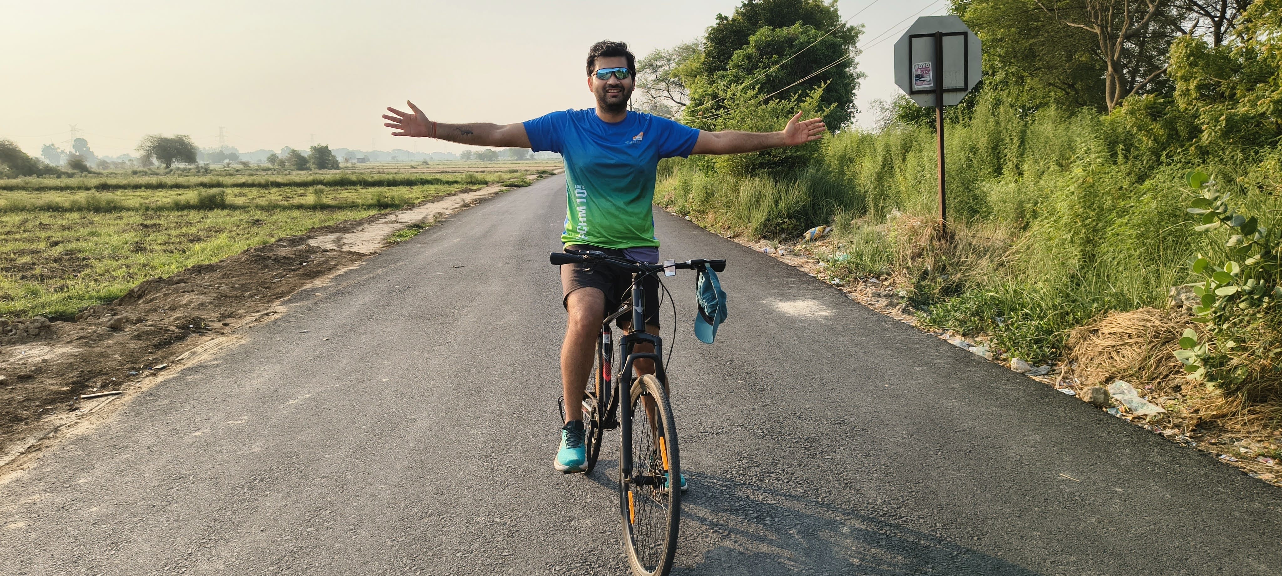 Cyclists riding along a scenic road
